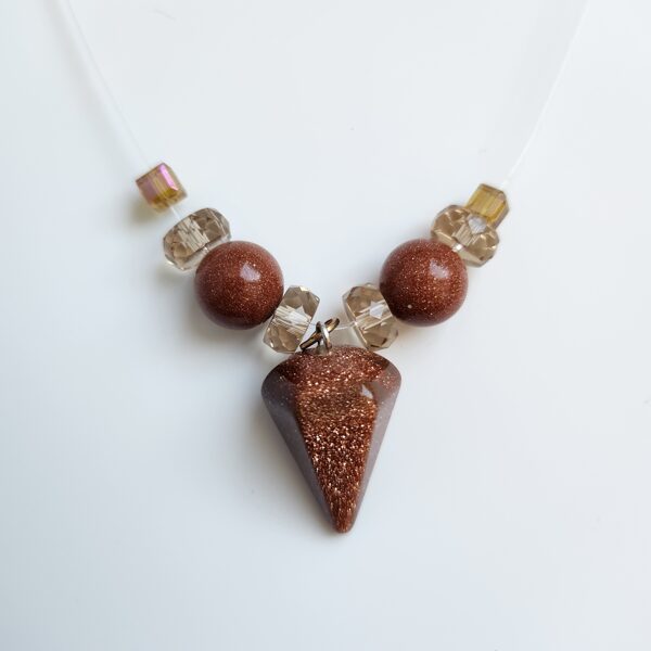 Caurspīdīgā kaklarota- Zelta smiltis